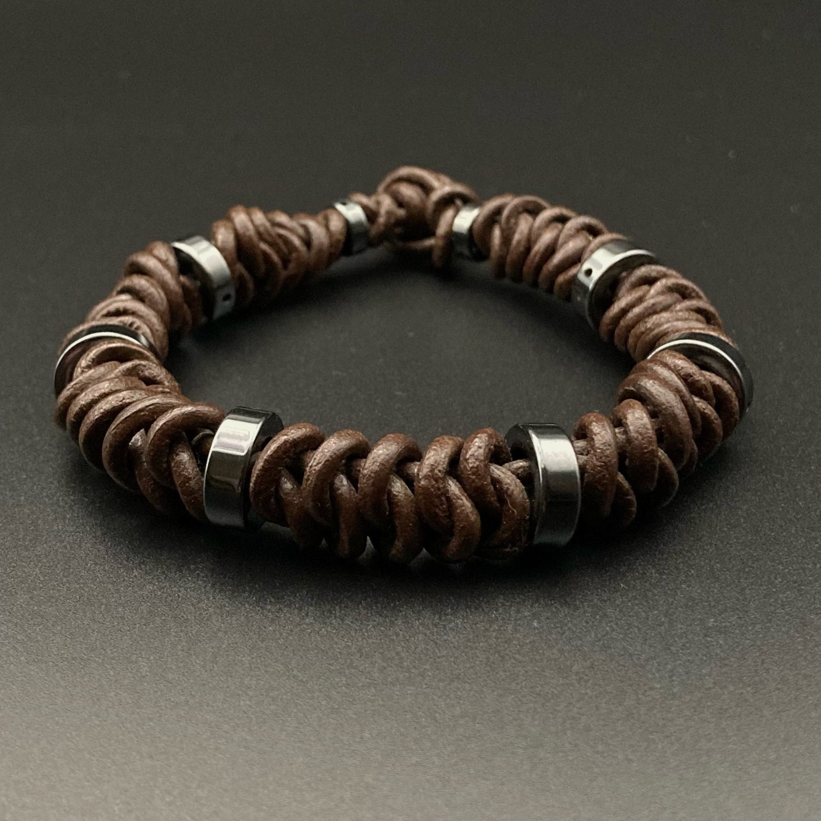 Brown knotted leather bracelet with hematite beads, by 3D Glass Designs.