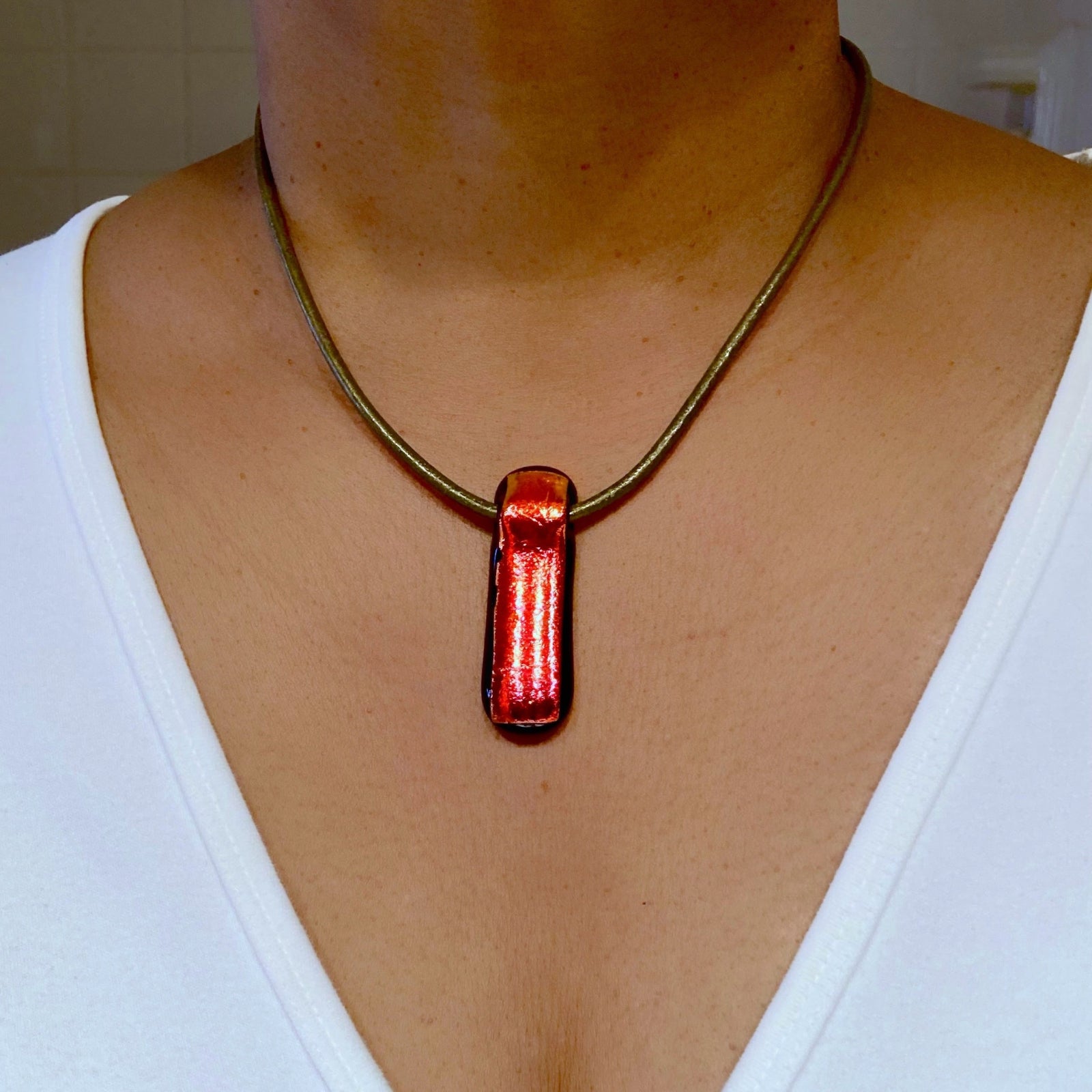 Model wearing Red fused glass pendant, by 3D Glass designs.