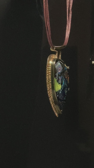 Video of handcrafted multicolor fused glass set in brass on a multistrand leather necklace, by 3D Glass Designs.