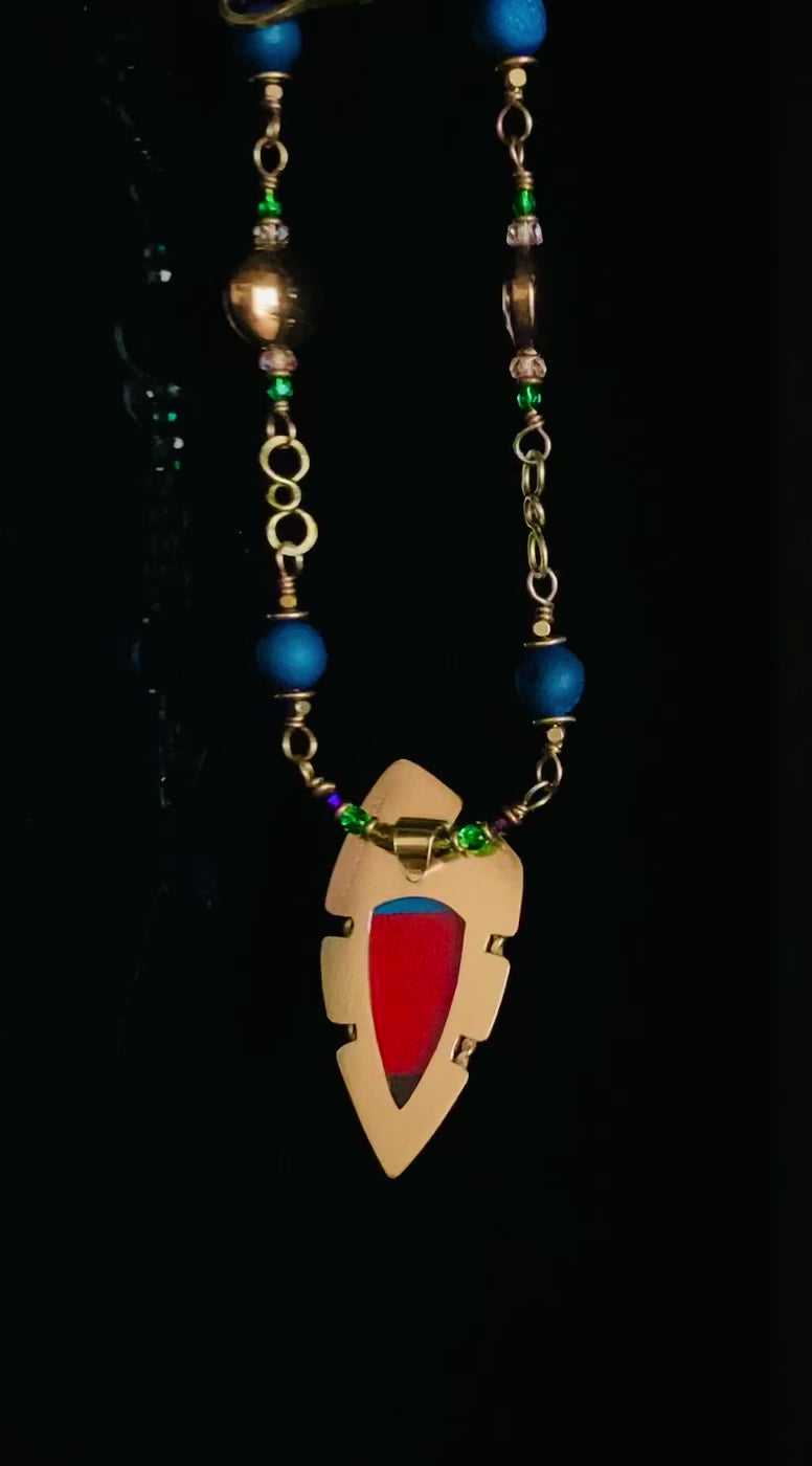 Video of colorful brass and dichroic glass pendant necklace on a handmade beaded chain. By 3D Glass Designs.