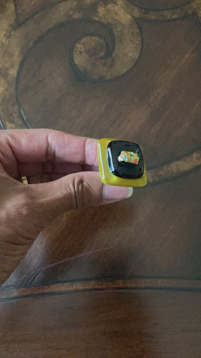 Hand showing different angles of fused glass cabinet knob, by 3D Glass Designs.