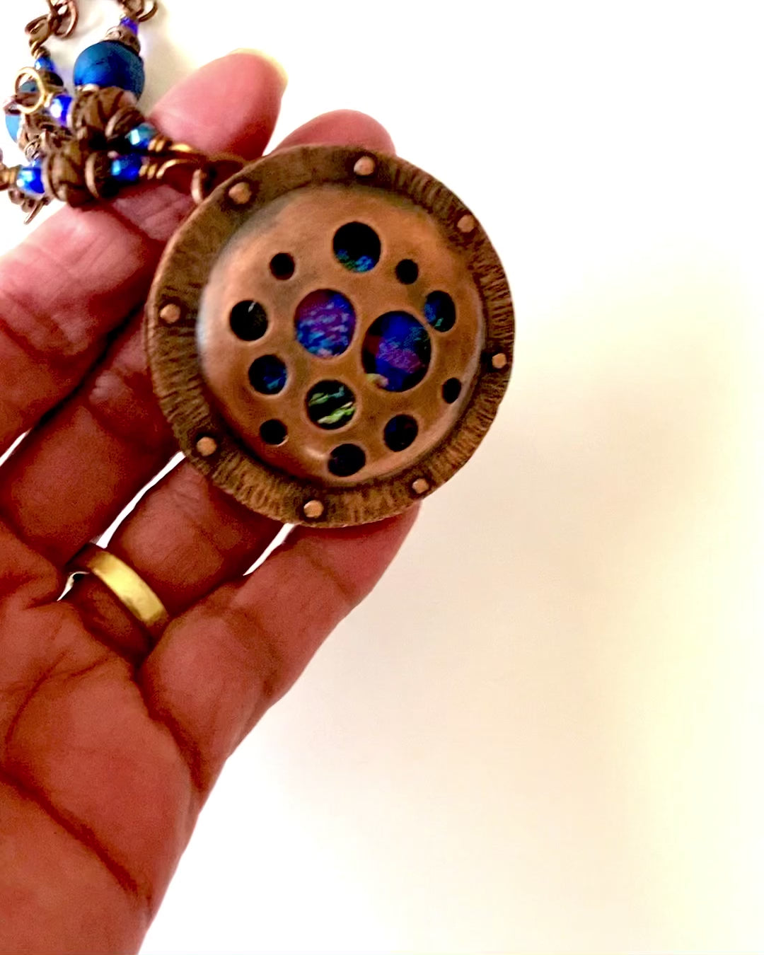 Video of copper and dichroic glass pendant necklace, by 3D Glass Designs.
