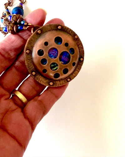 Video of copper and dichroic glass pendant necklace, by 3D Glass Designs.